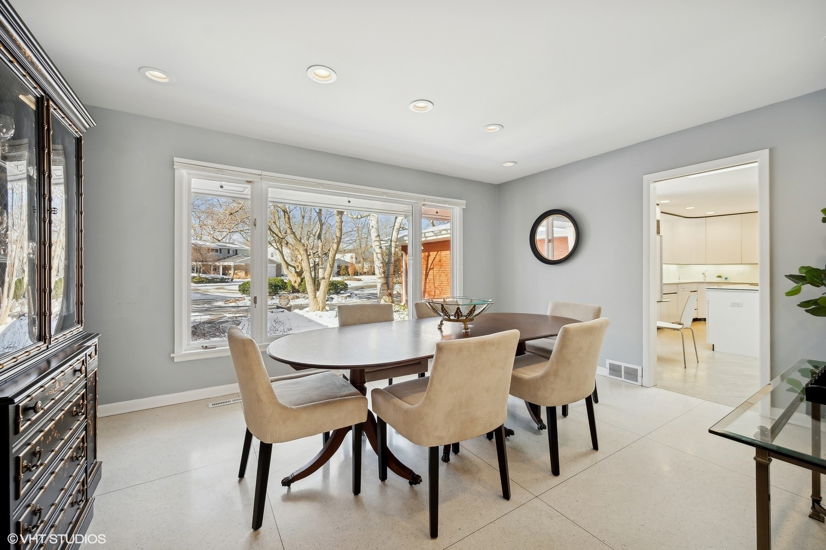 718 Chilton Lane Wilmette, IL 60091 - Photo 12 of 48 a view of a dining room with furniture and a large window