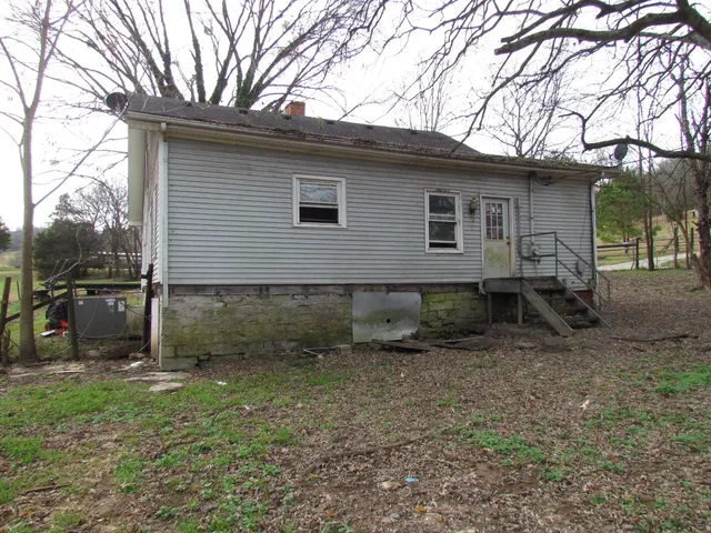 a view of a back yard of the house