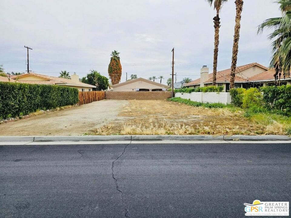 51630 Avenida Villa La Quinta, CA 92253 - Photo 1 of 2 a front view of a house with a garden and trees