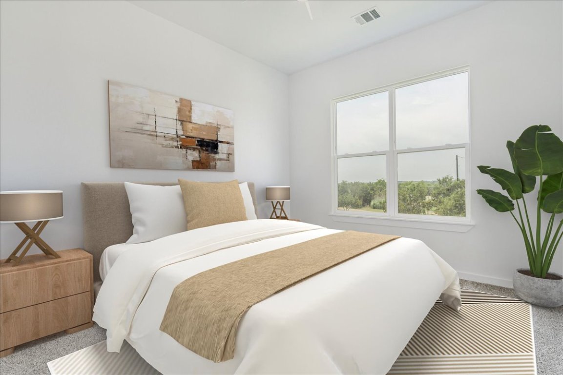 126 Lourdes Court, Unit B Dripping Springs, TX 78620 - Photo 16 of 19 a bedroom with bed and a window