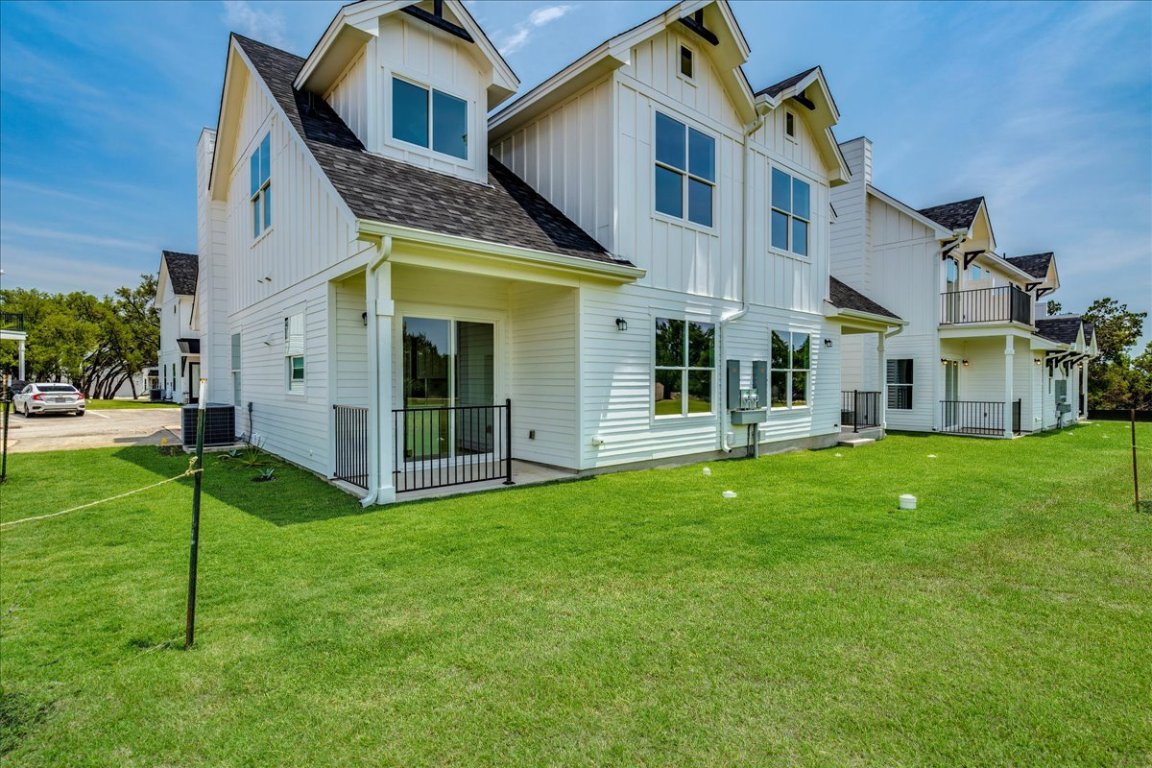 126 Lourdes Court, Unit B Dripping Springs, TX 78620 - Photo 18 of 19 a view of an house with backyard and garden