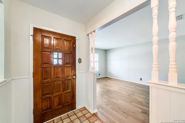 a view of empty room with windows