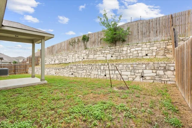 a view of swimming pool with outdoor seating and yard
