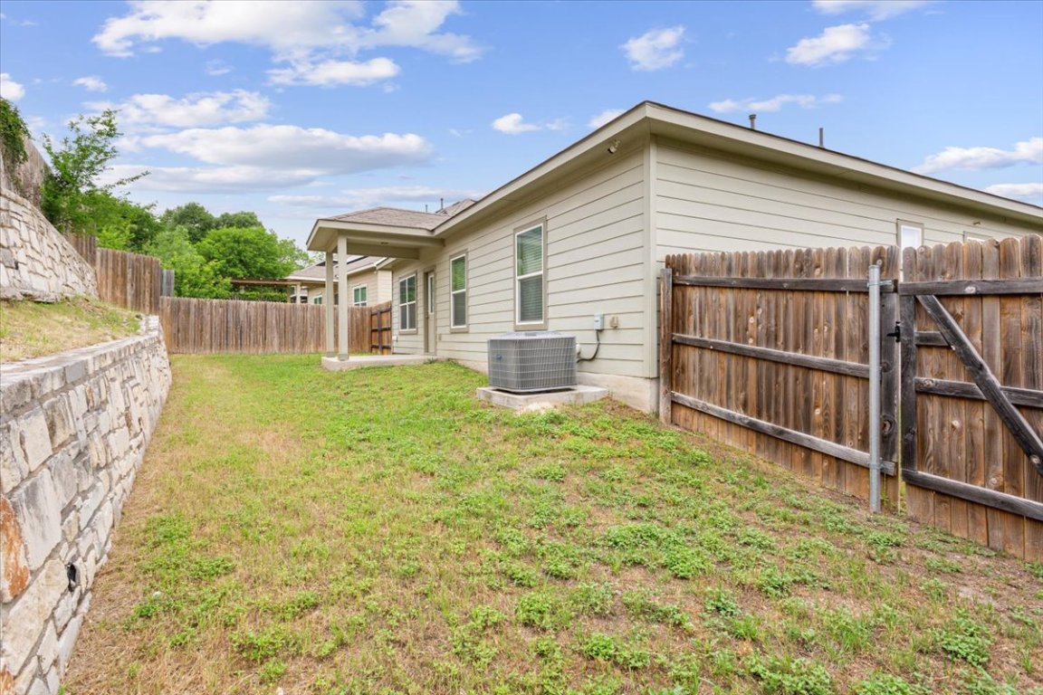 1504 Maier Drive Pflugerville, TX 78660 - Photo 23 of 31 a backyard of a house with table and chairs