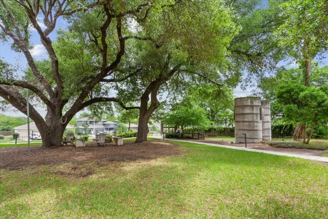 a view of a tree in front of a house