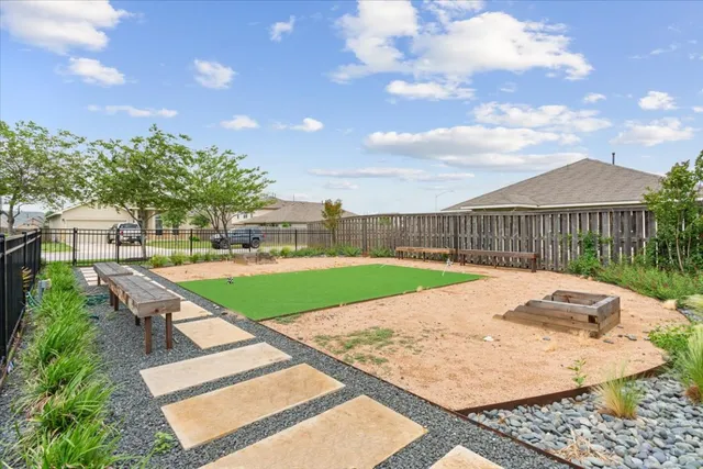 a view of swimming pool with seating space