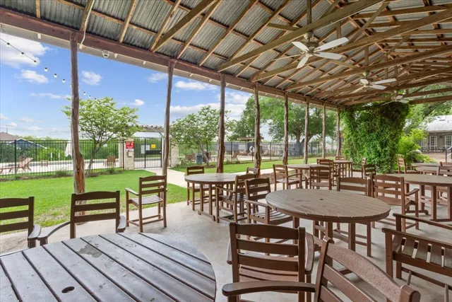 a view of a patio with swimming pool
