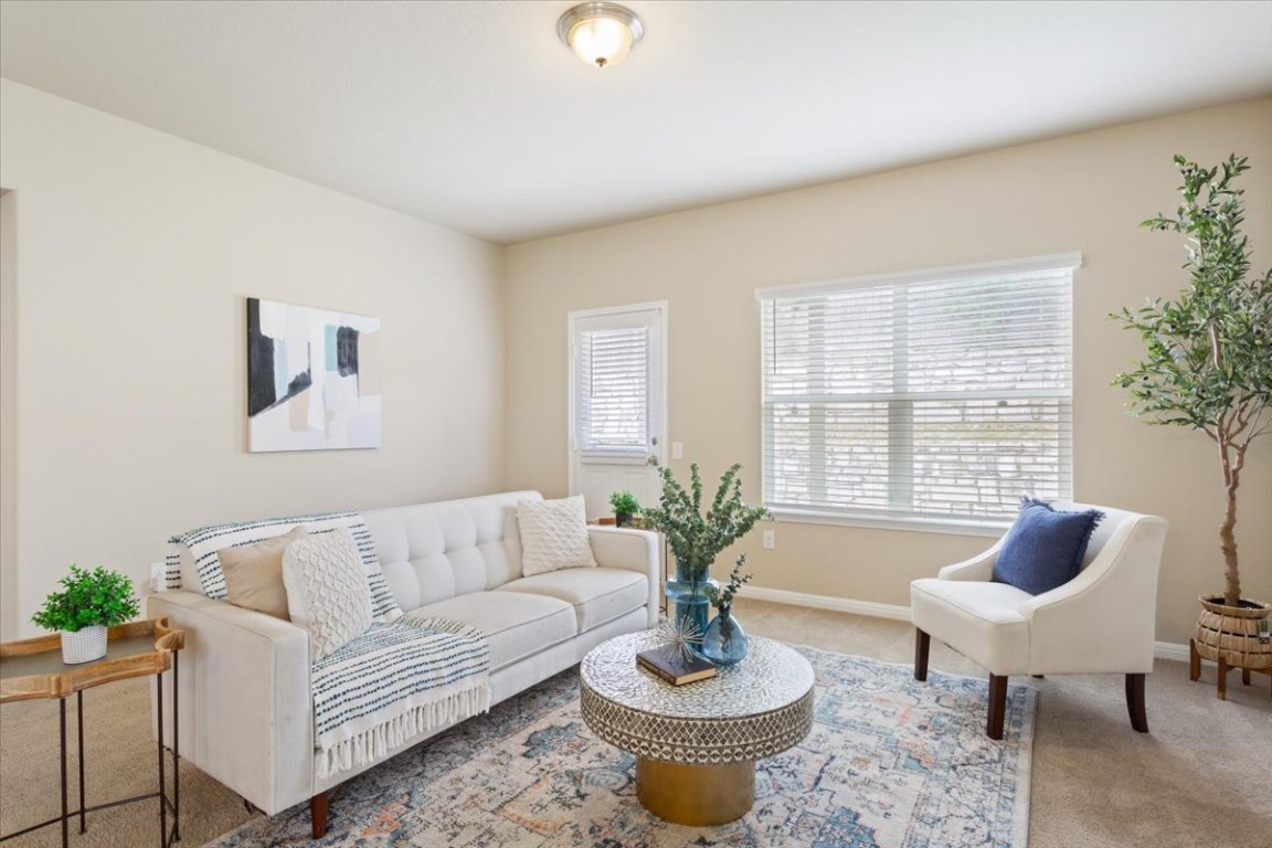 1504 Maier Drive Pflugerville, TX 78660 - Photo 3 of 31 a living room with furniture potted plant and a large window