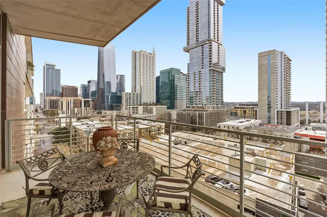 a view of a balcony with chairs
