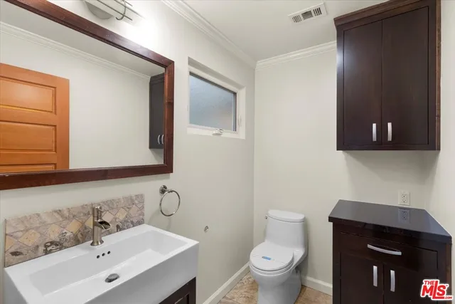 a bathroom with a sink and a toilet