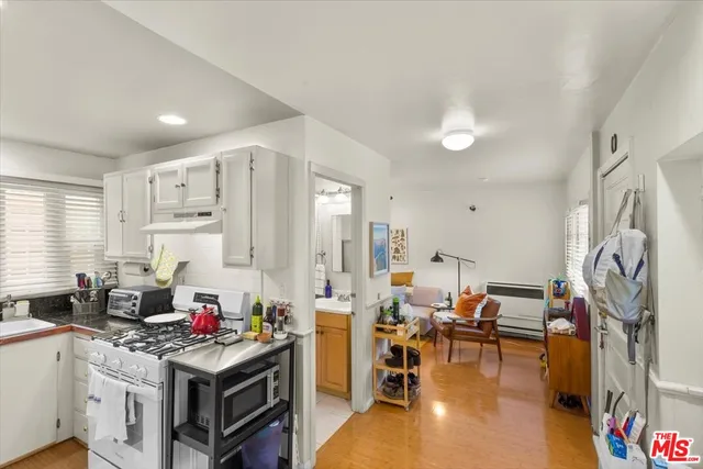 a view of a livingroom with furniture and a window