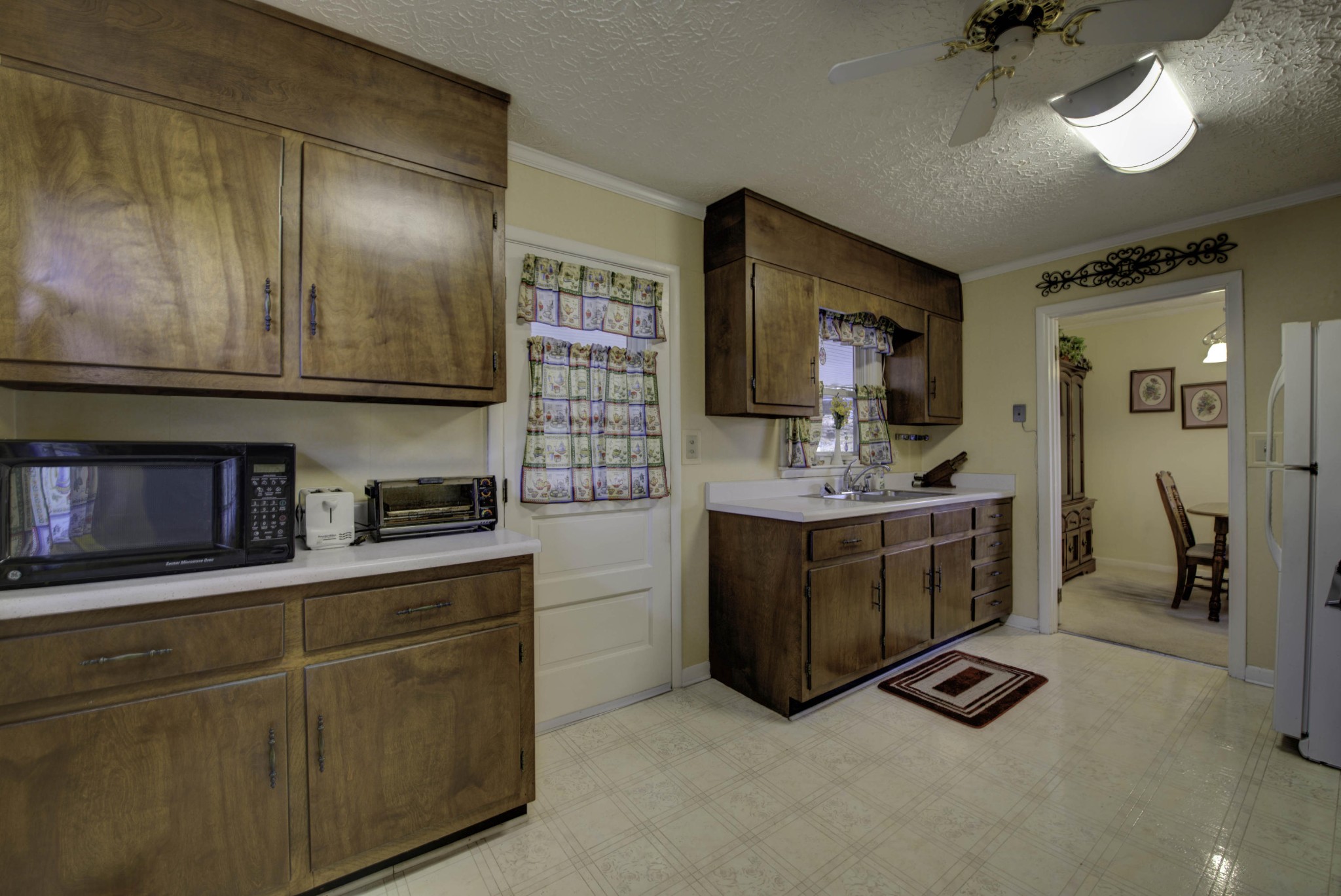 112 South Seneca Road Oak Ridge, TN 37830 - Photo 8 of 20 a kitchen with stainless steel appliances granite countertop a stove a sink and a microwave