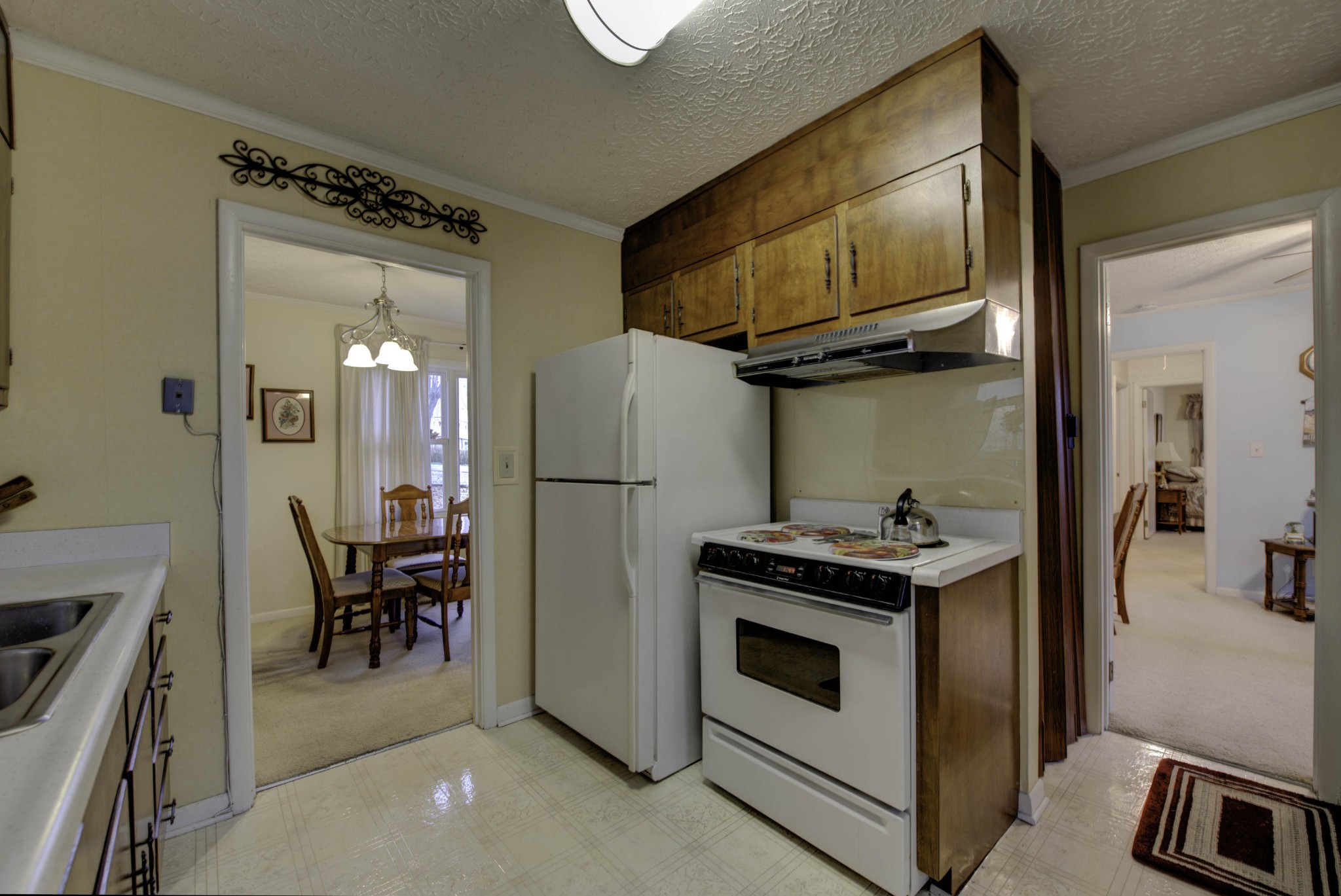 112 South Seneca Road Oak Ridge, TN 37830 - Photo 9 of 20 a kitchen with a stove and a refrigerator