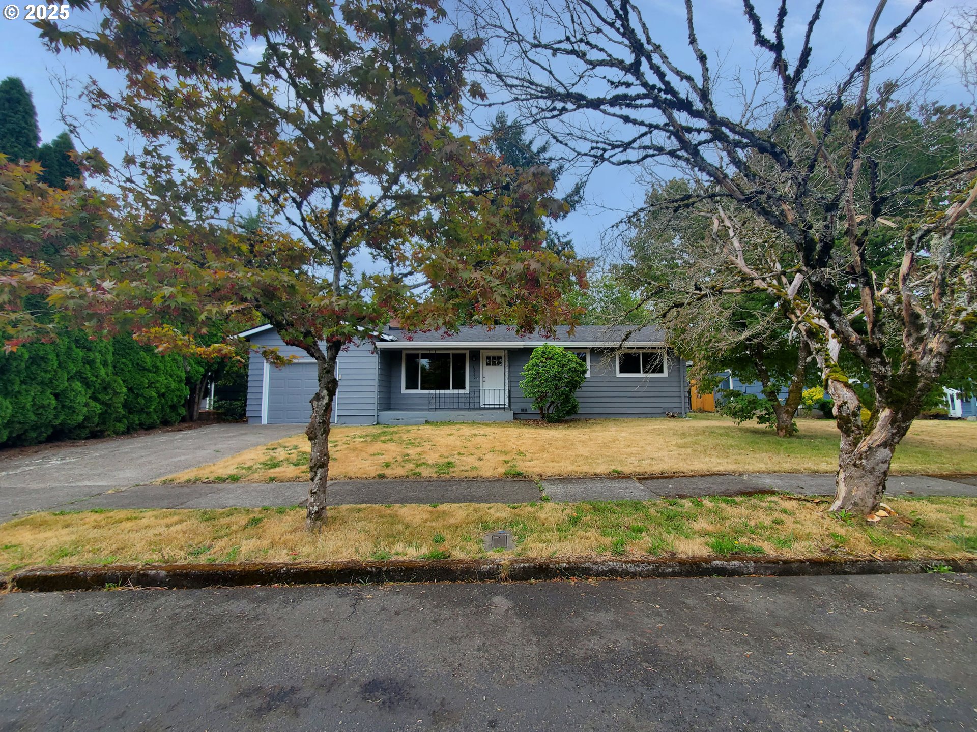 13050 Southeast Morrison Street Portland, OR 97233 - Photo 1 of 21 a front view of a house with a yard