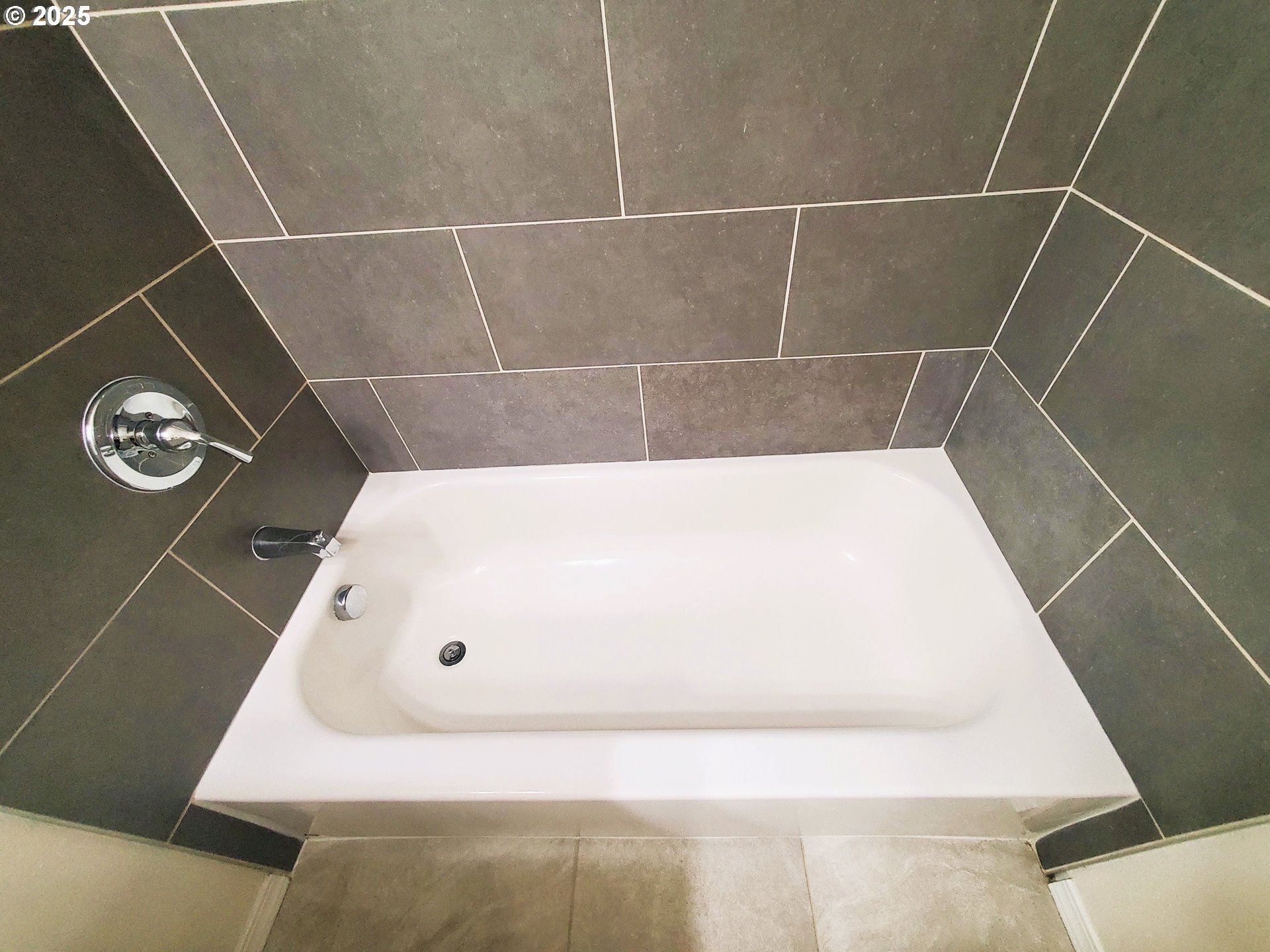 13050 Southeast Morrison Street Portland, OR 97233 - Photo 11 of 21 a bathroom with a tub