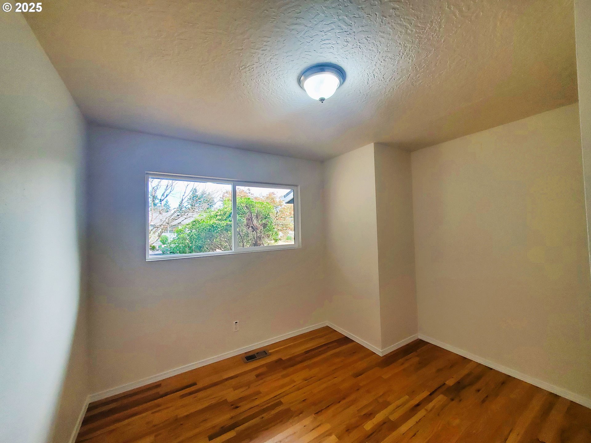 13050 Southeast Morrison Street Portland, OR 97233 - Photo 15 of 21 a view of an empty room with a window