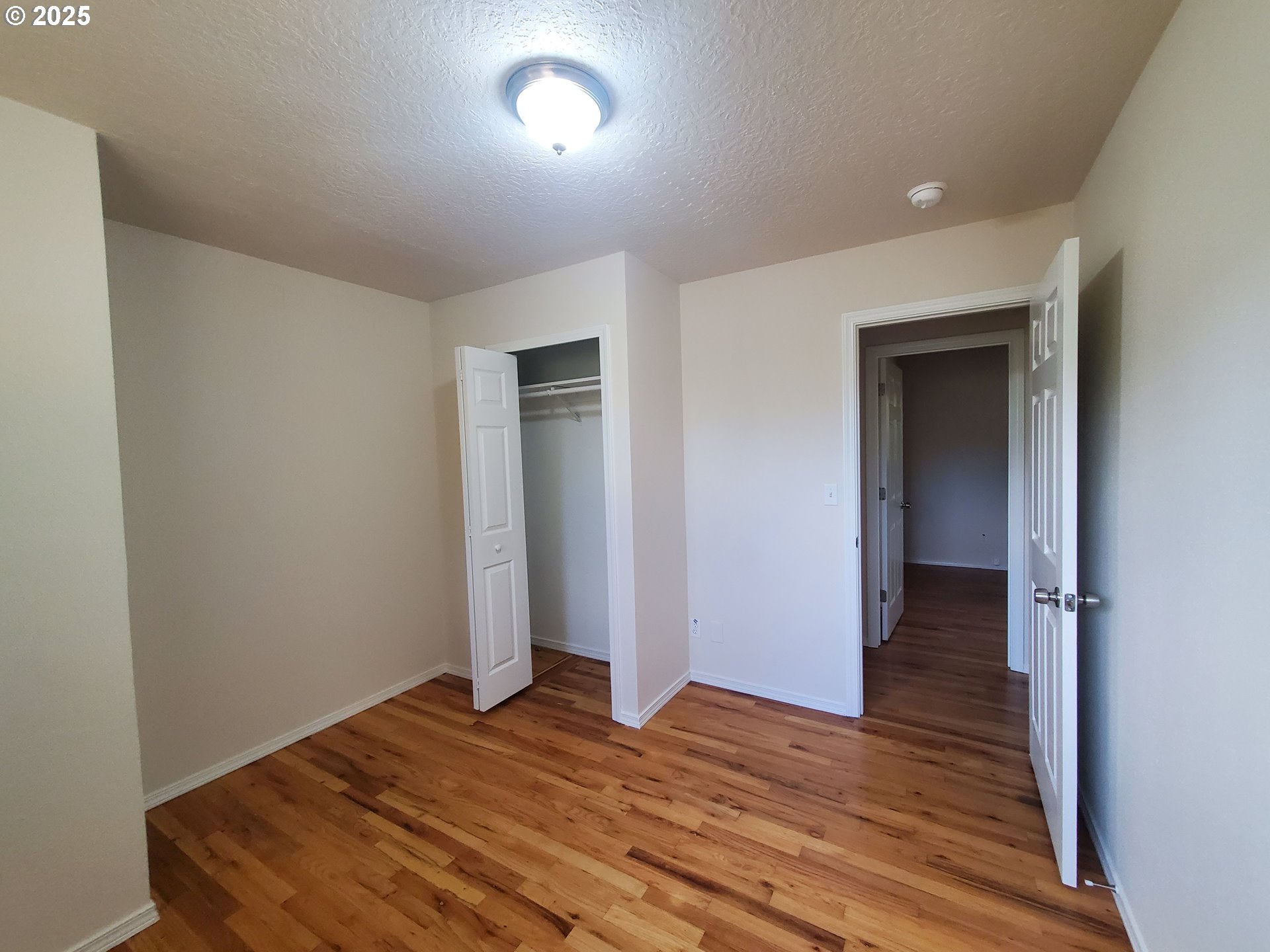 13050 Southeast Morrison Street Portland, OR 97233 - Photo 16 of 21 a view of a livingroom with wooden floor and closet