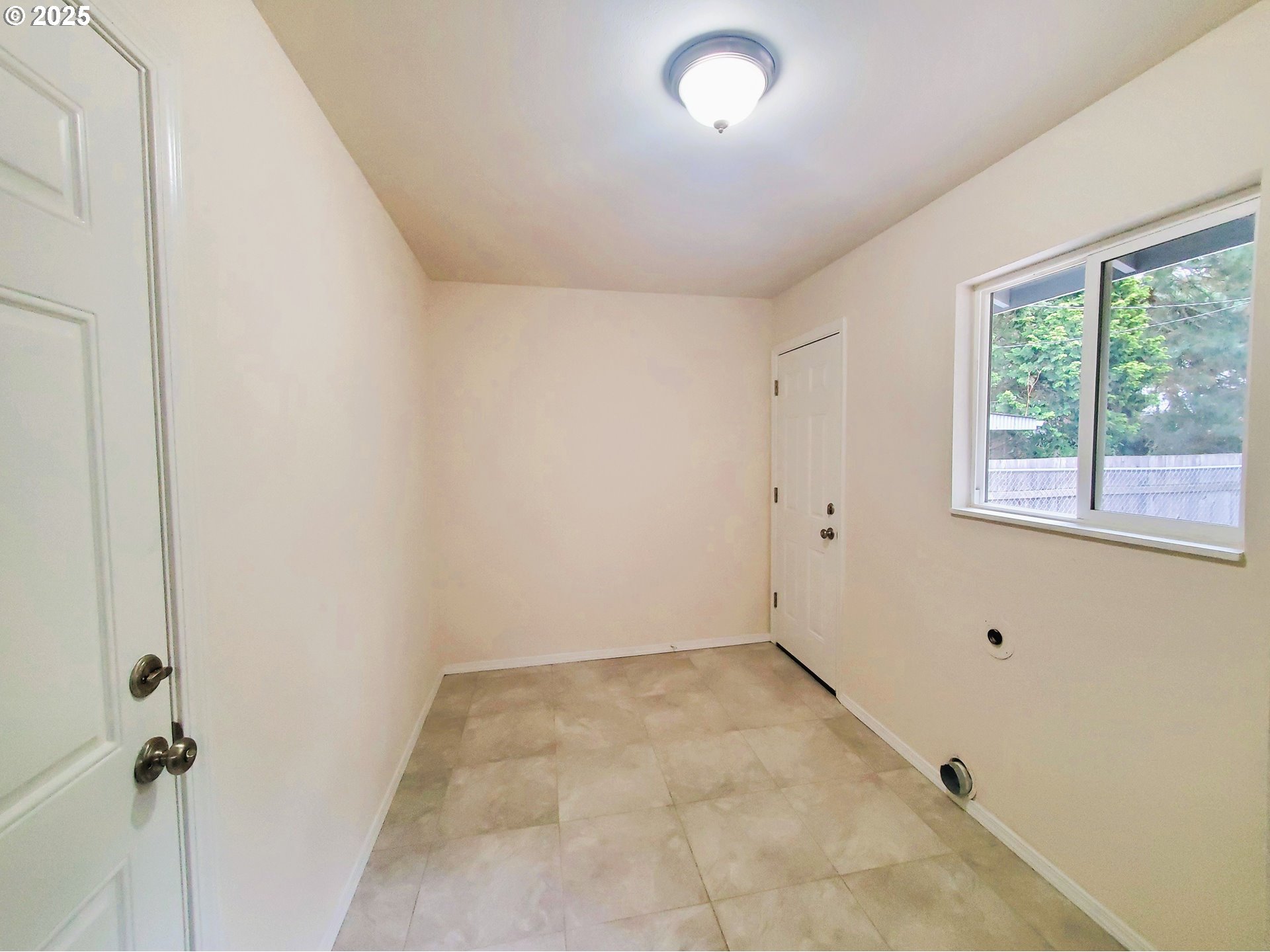 13050 Southeast Morrison Street Portland, OR 97233 - Photo 6 of 21 an empty room with a window