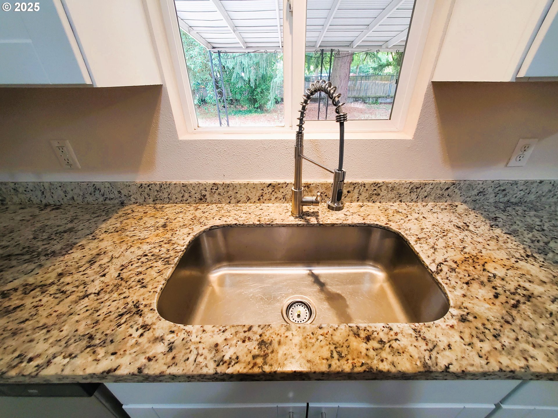 13050 Southeast Morrison Street Portland, OR 97233 - Photo 9 of 21 a bathroom with a sink and a granite counter top