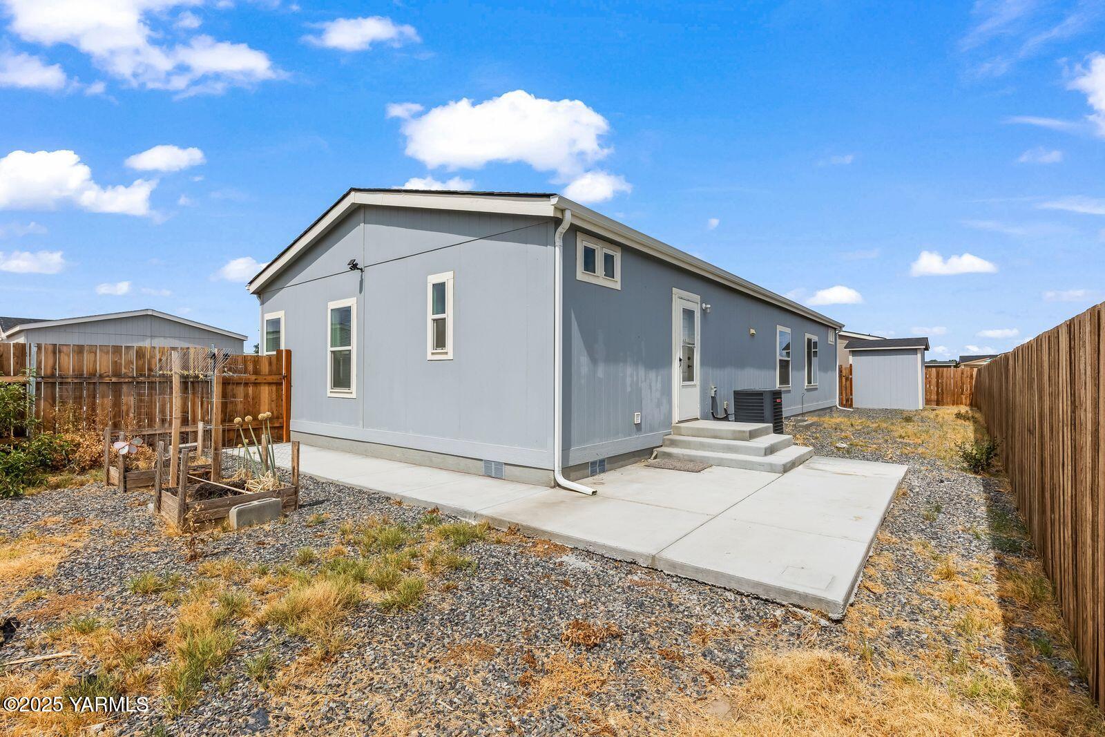 2802 South 5th Avenue, Unit 30 Union Gap, WA 98903 - Photo 22 of 23 a view of a house with backyard