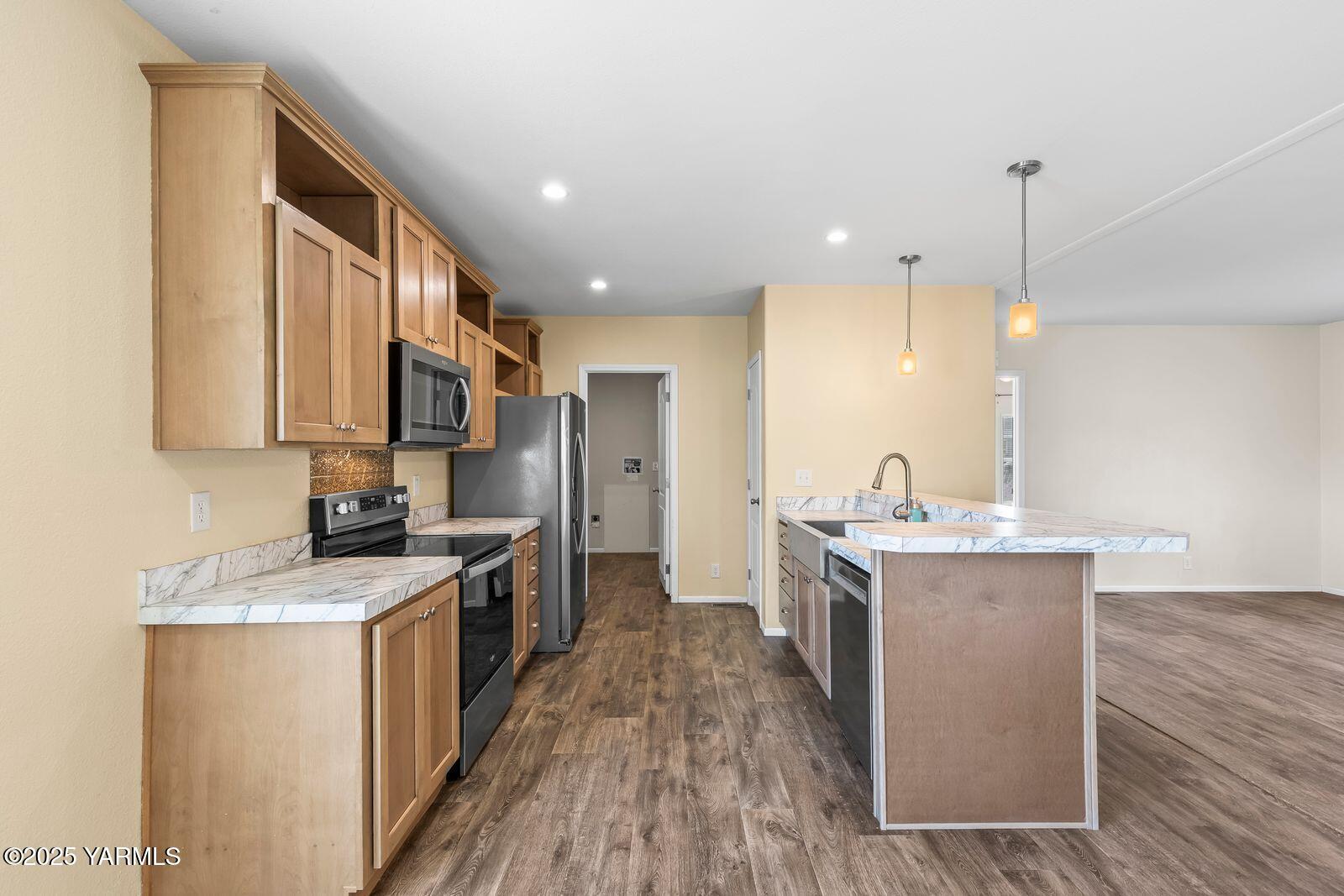 2802 South 5th Avenue, Unit 30 Union Gap, WA 98903 - Photo 7 of 23 a kitchen with a sink stove top oven and refrigerator