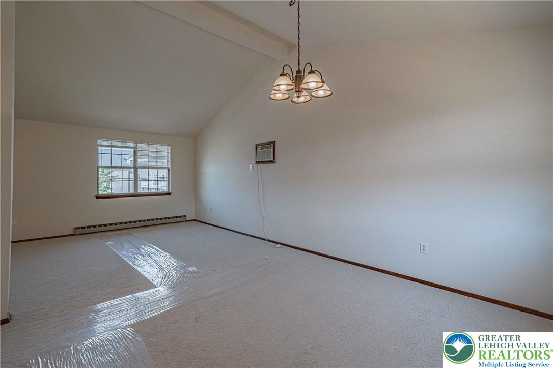 25 North 8th Street Emmaus, PA 18049 - Photo 22 of 51 A window-filled living area offers vaulted ceilings and soft carpeting, perfect for quiet enjoyment.