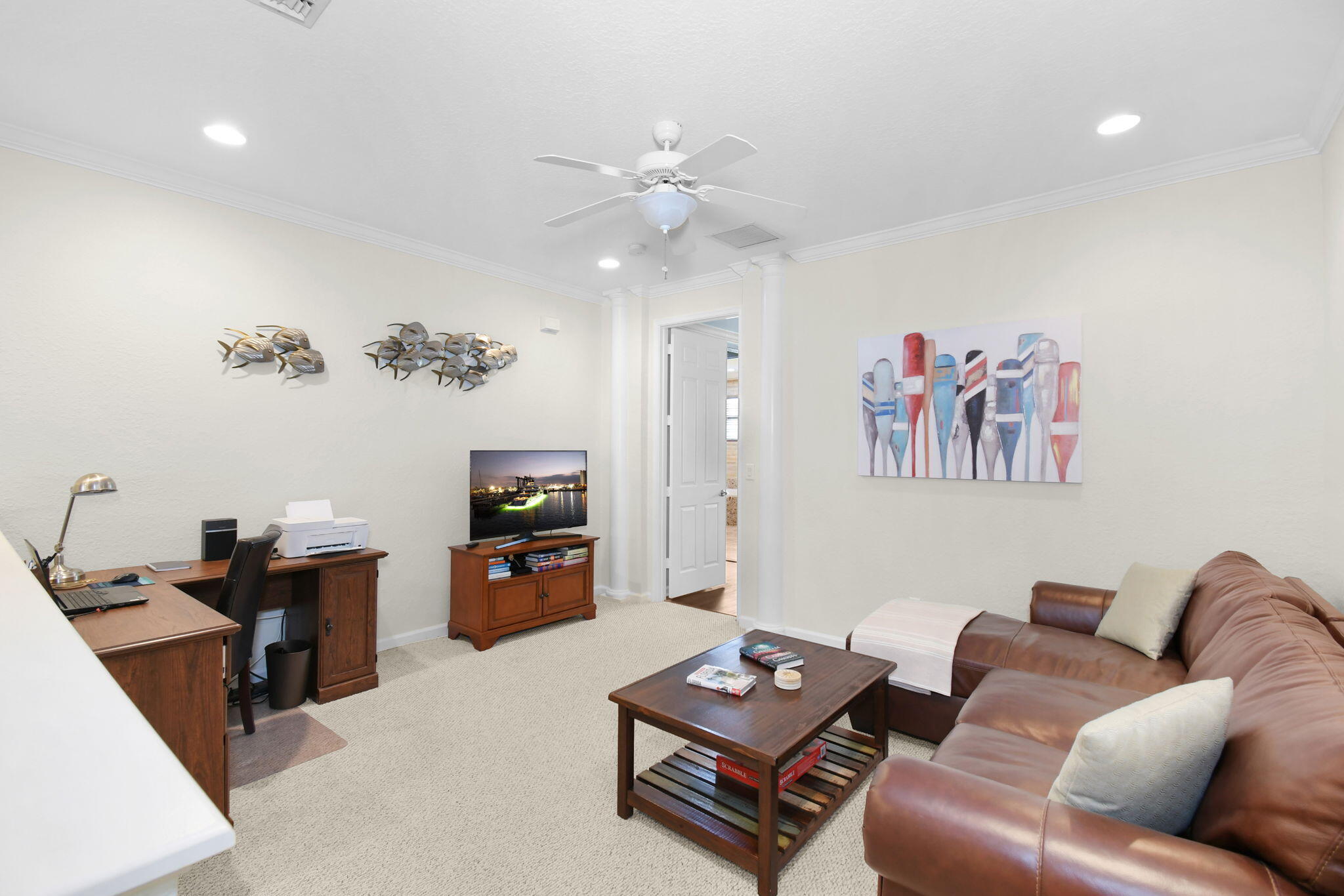 254 Southwest Walking Path Stuart, FL 34997 - Photo 17 of 31 a living room with furniture and a chandelier
