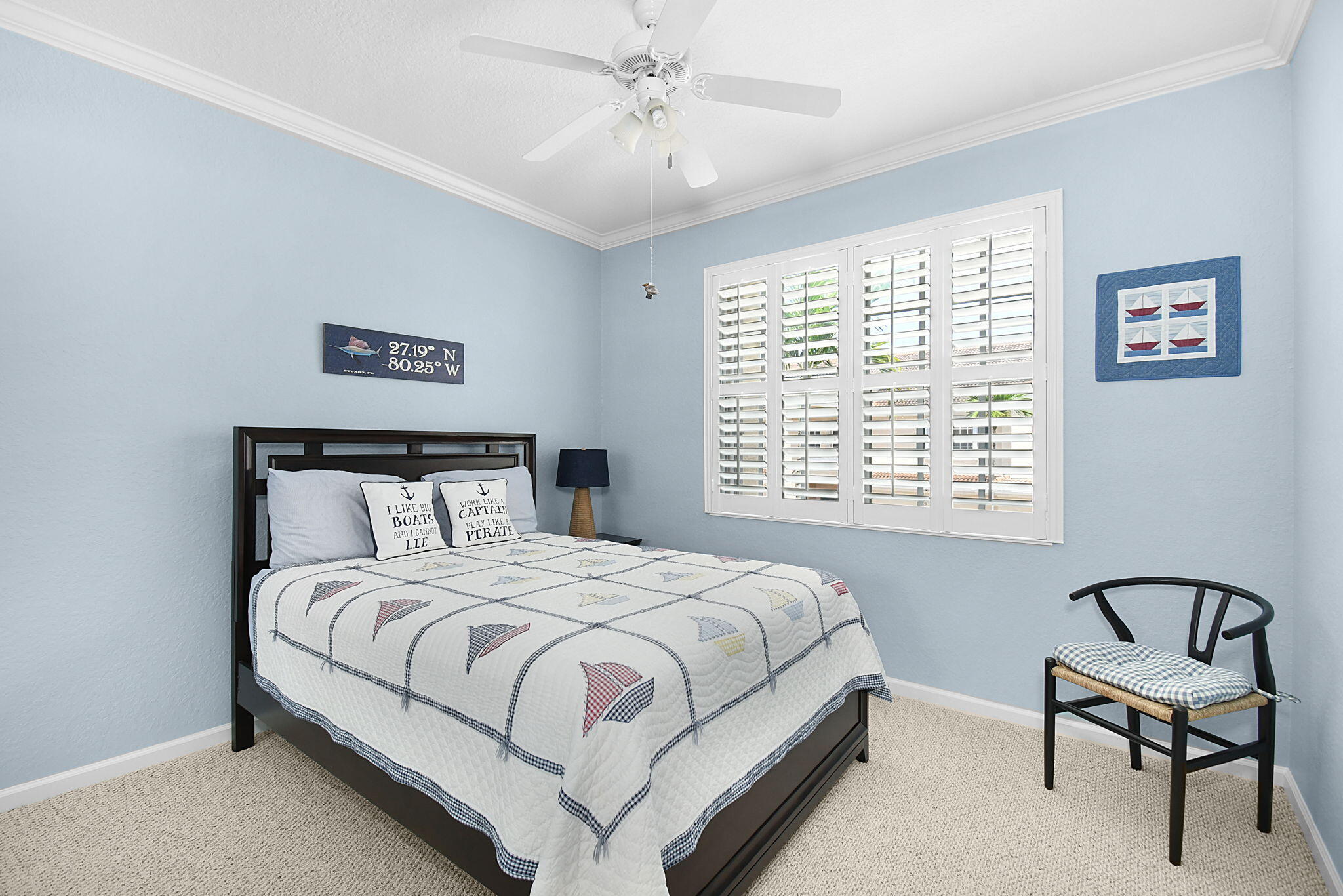 254 Southwest Walking Path Stuart, FL 34997 - Photo 18 of 31 a bedroom with a bed and a window