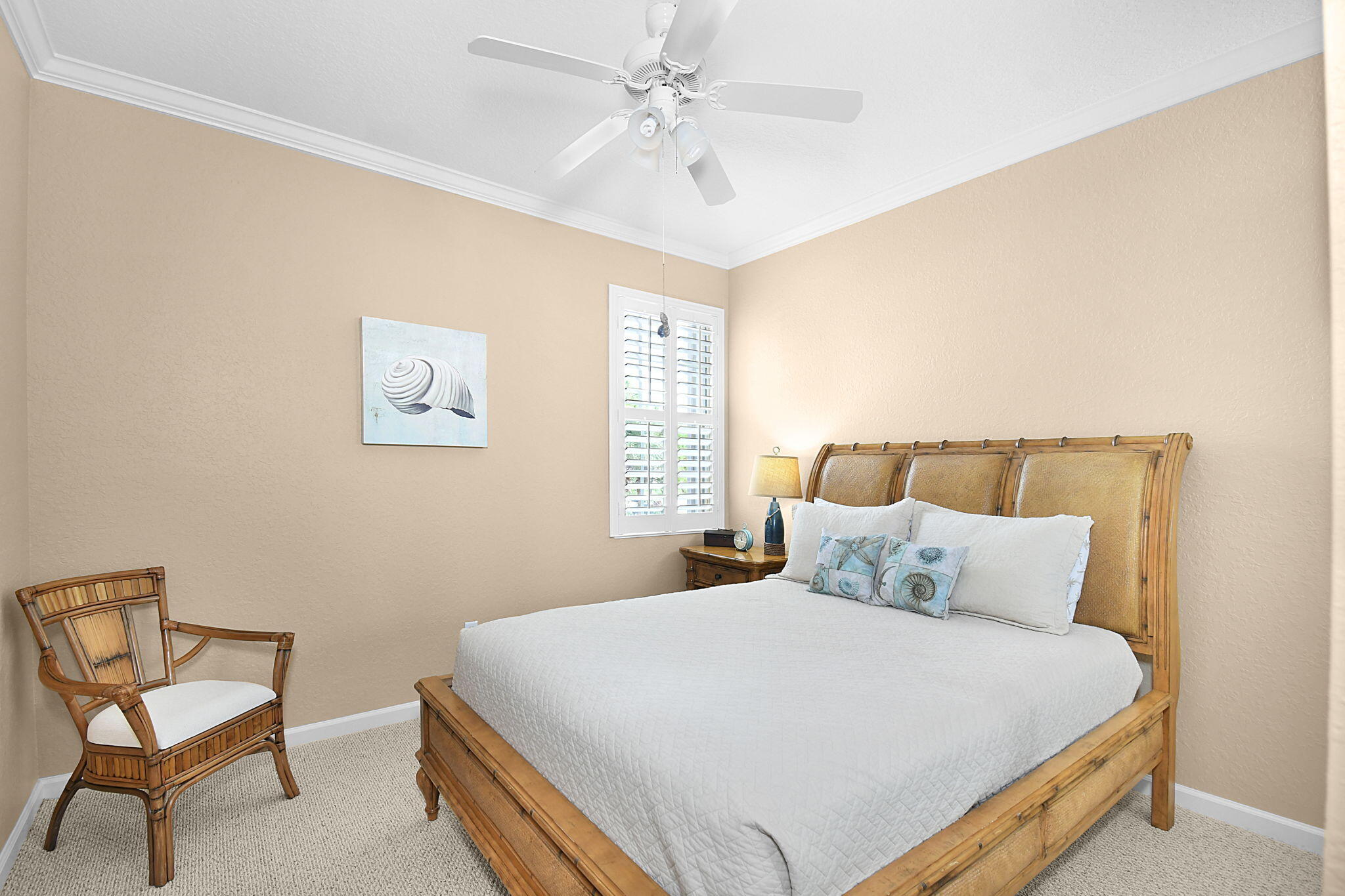 254 Southwest Walking Path Stuart, FL 34997 - Photo 20 of 31 a bedroom with a bed and chair
