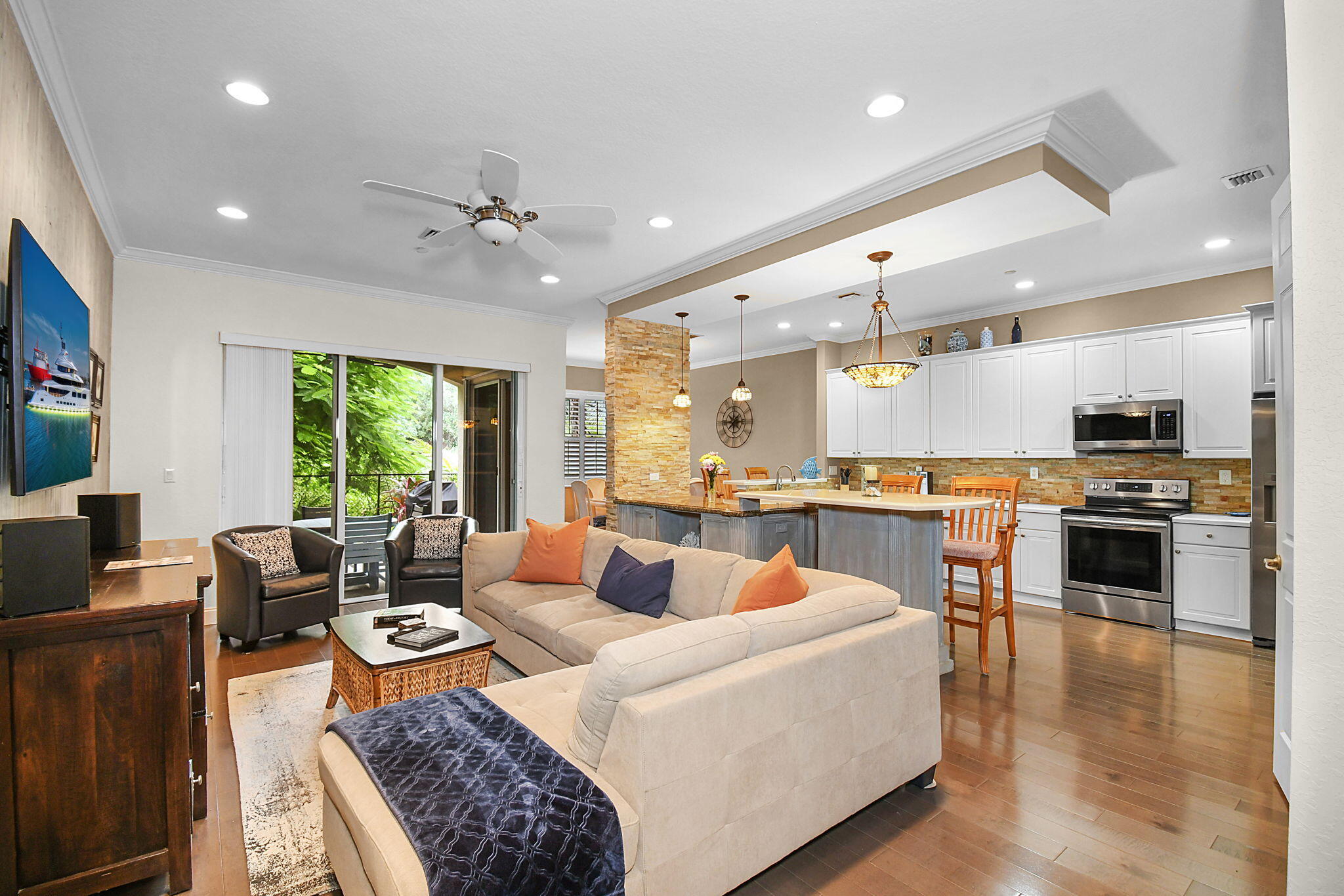 254 Southwest Walking Path Stuart, FL 34997 - Photo 2 of 31 a living room with stainless steel appliances furniture and a kitchen view