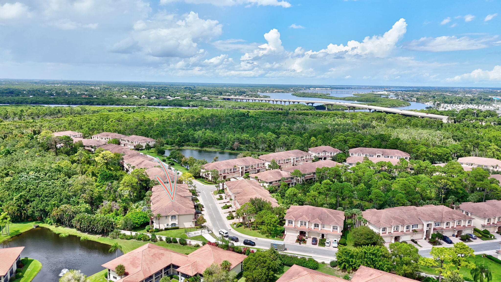 254 Southwest Walking Path Stuart, FL 34997 - Photo 31 of 31 an aerial view of a houses with outdoor space and lake view