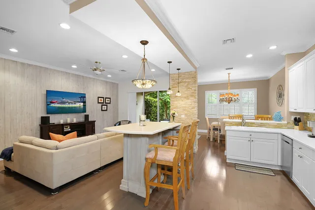 a large kitchen with a table and chairs