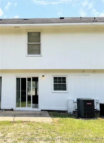 a view of a house with swimming pool in front of it