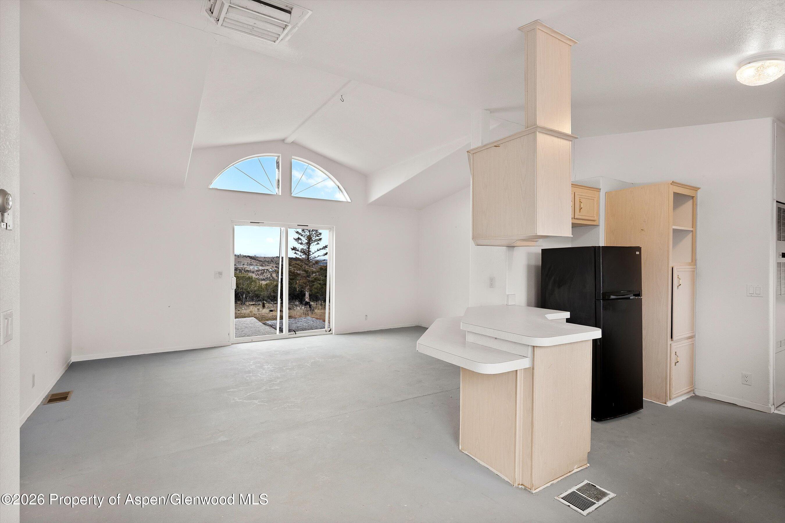 378 Alta Mesa Road Silt, CO 81652 - Photo 11 of 20 a view of a kitchen with a sink and a fireplace