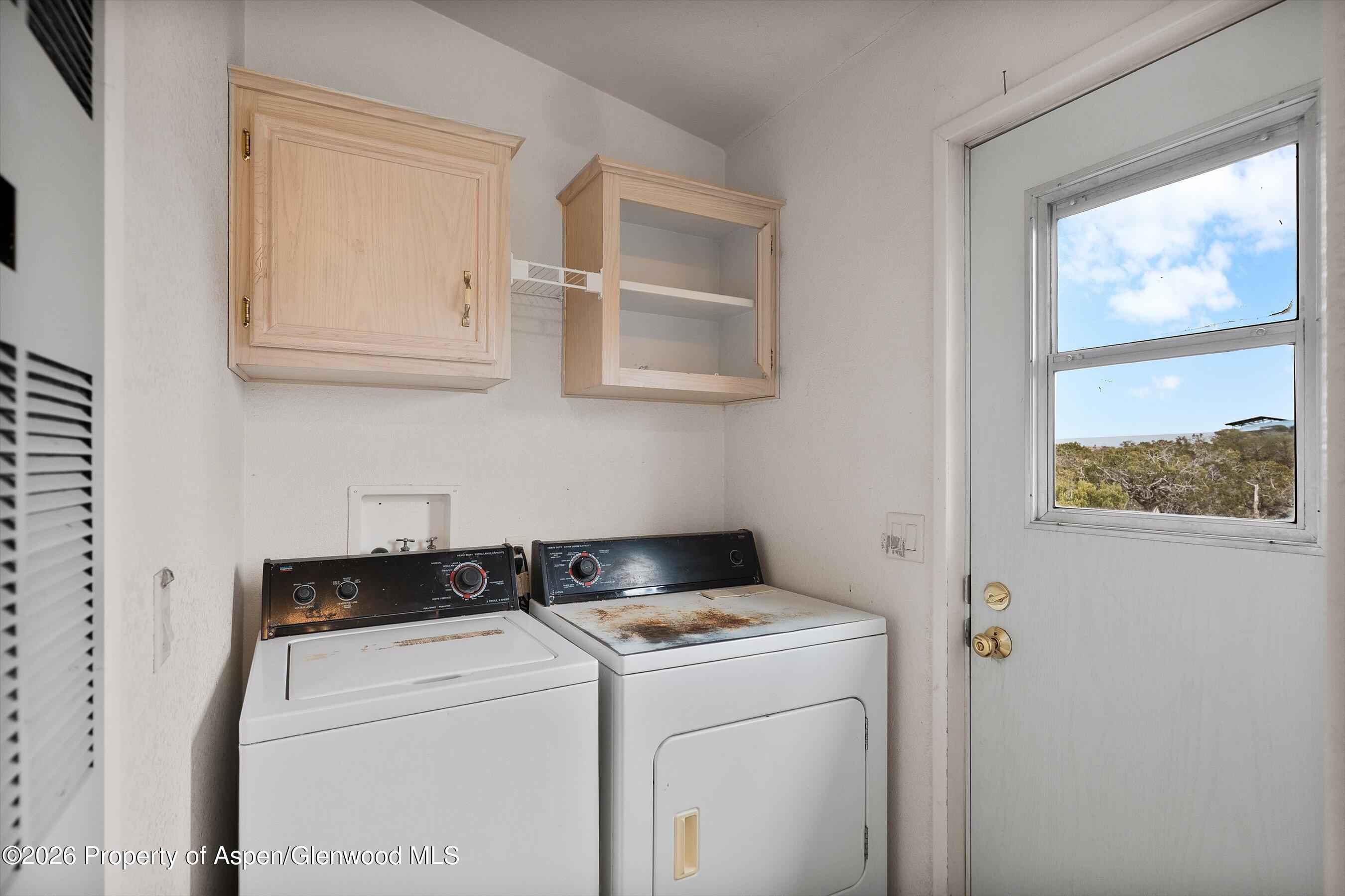 378 Alta Mesa Road Silt, CO 81652 - Photo 14 of 20 a utility room with dryer and washer