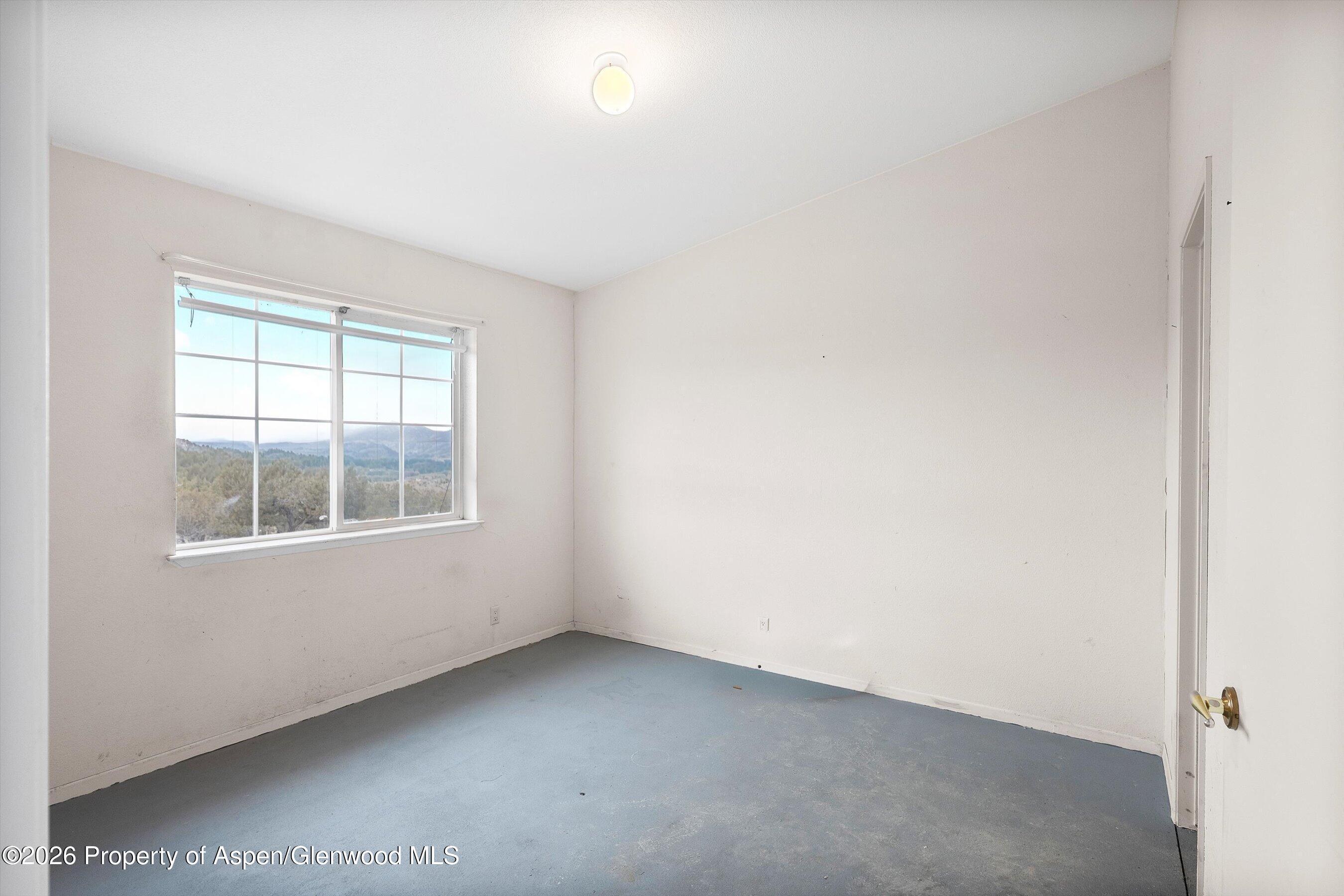 378 Alta Mesa Road Silt, CO 81652 - Photo 15 of 20 an empty room with a window