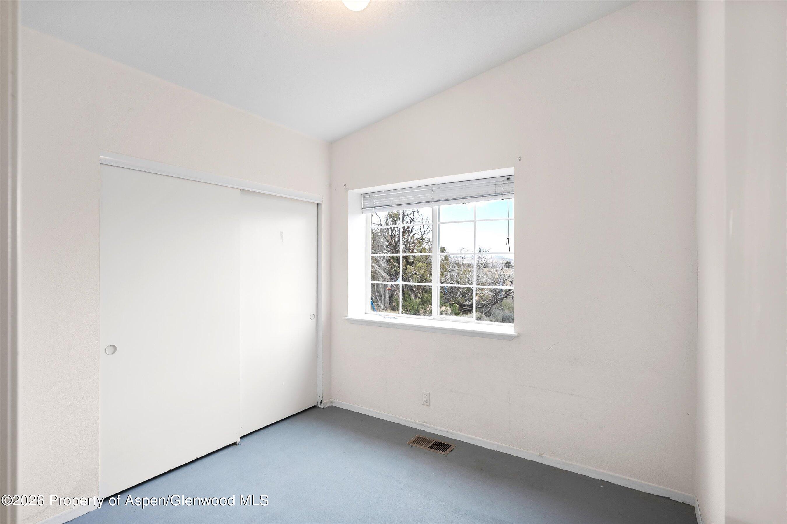 378 Alta Mesa Road Silt, CO 81652 - Photo 17 of 20 an empty room with a window