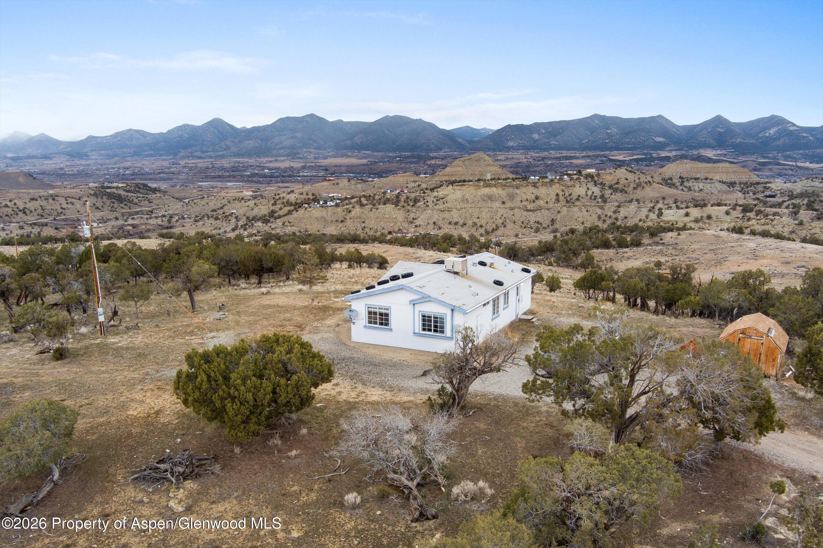 378 Alta Mesa Road Silt, CO 81652 - Photo 2 of 20 a view of a lake with a mountain