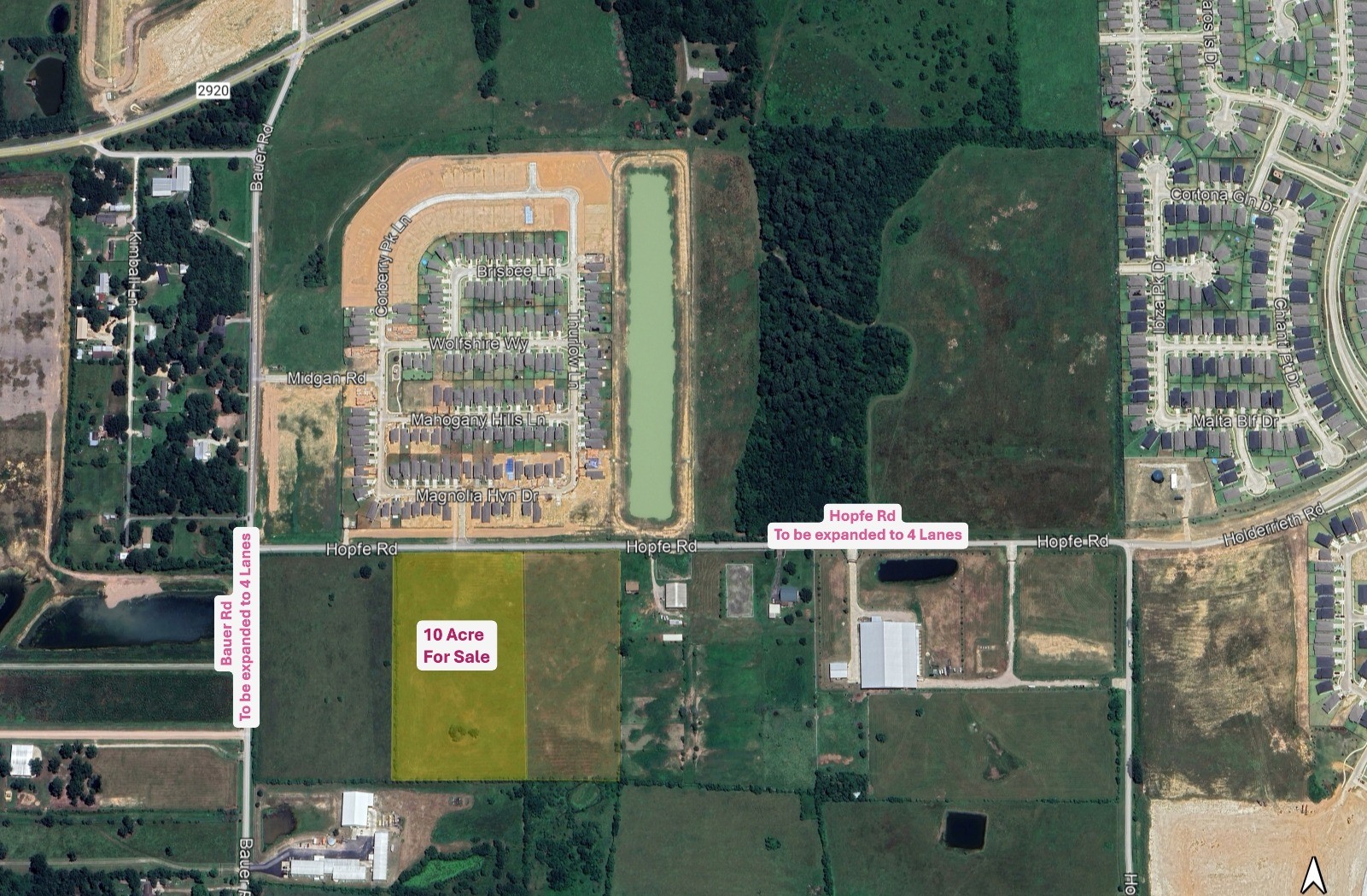 an aerial view of a residential houses with outdoor space