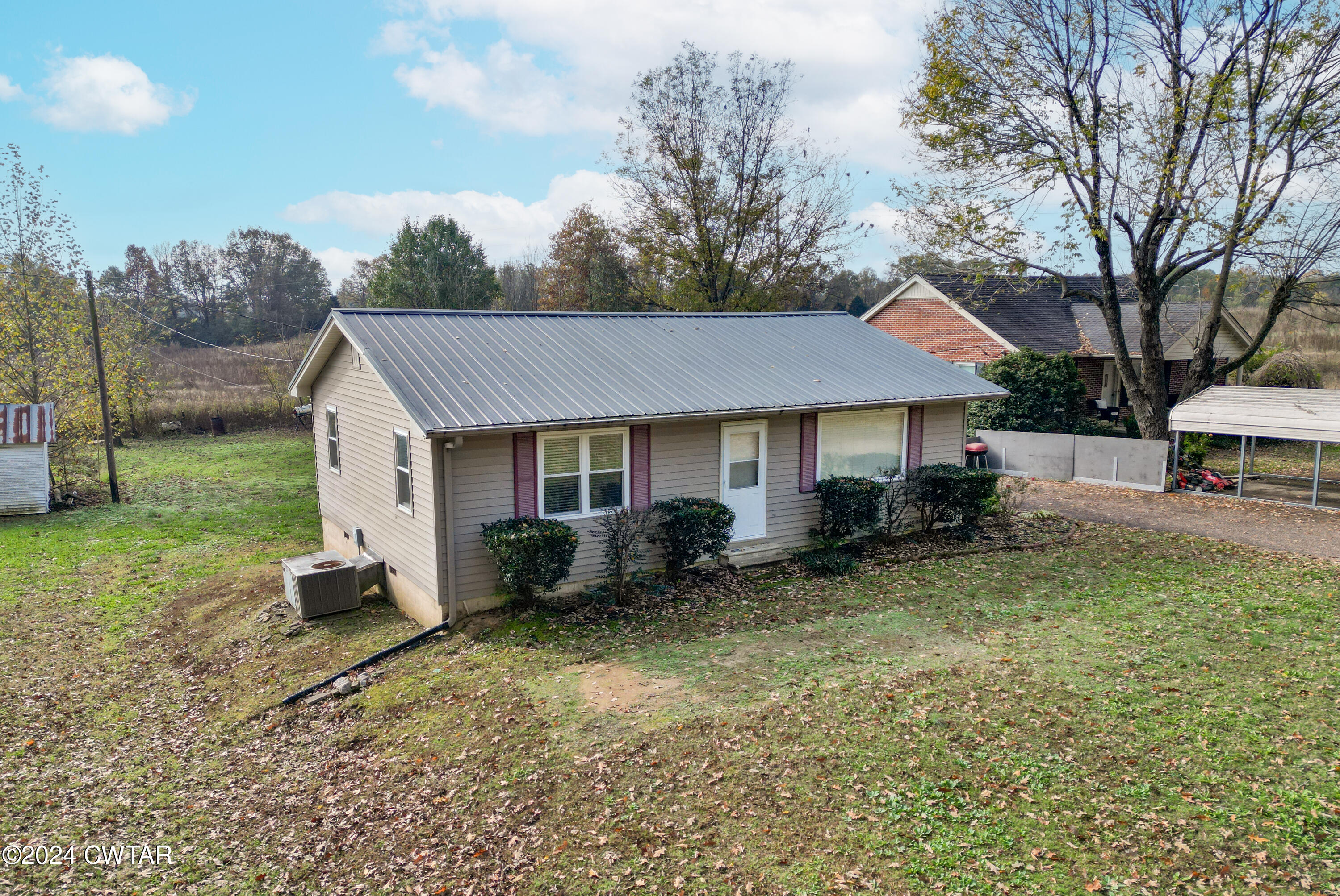2620 Old Jackson Road Bells, TN 38006 - Photo 3 of 10 a front view of a house with garden