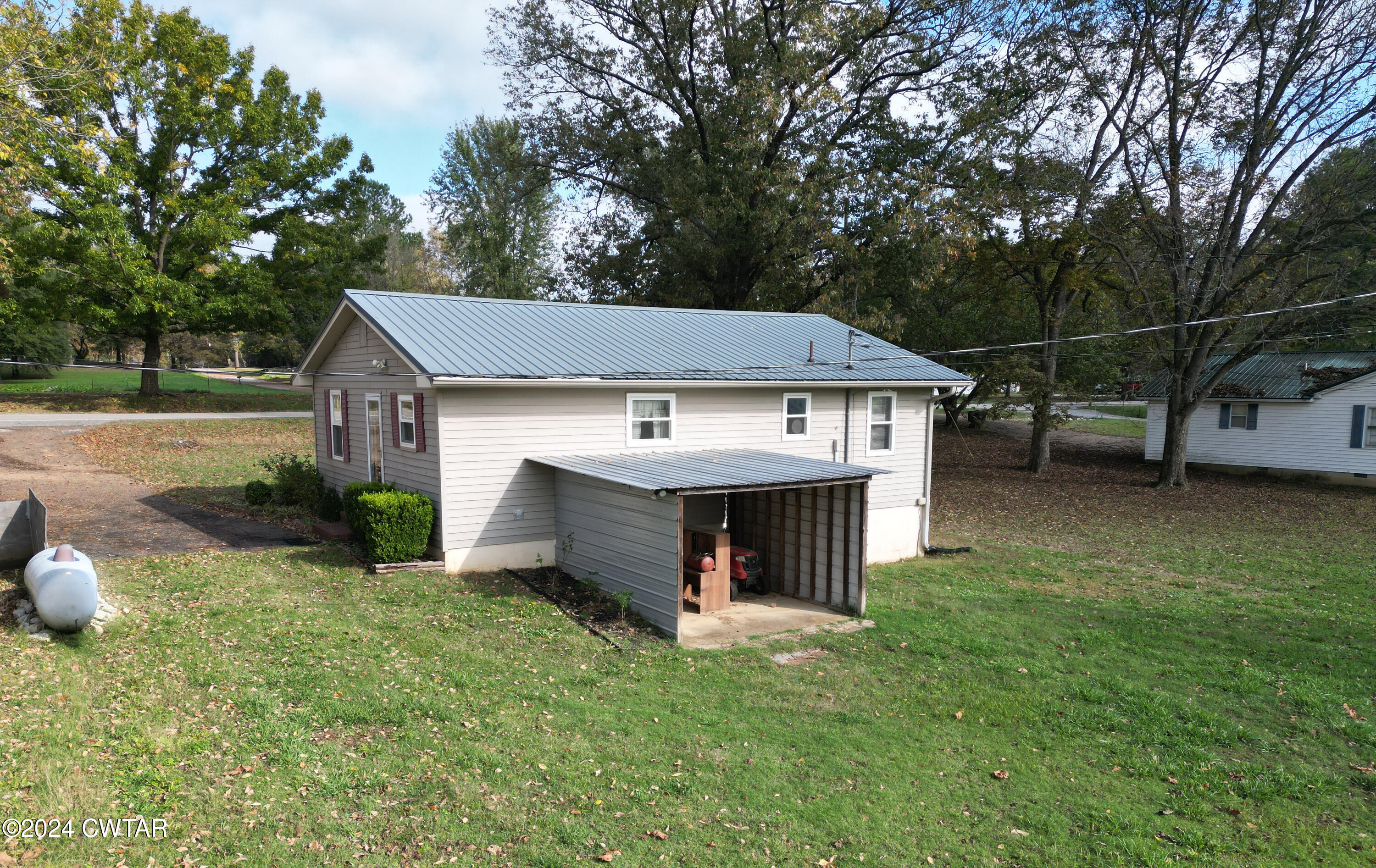 2620 Old Jackson Road Bells, TN 38006 - Photo 4 of 10 a view of a house with a yard and large tree