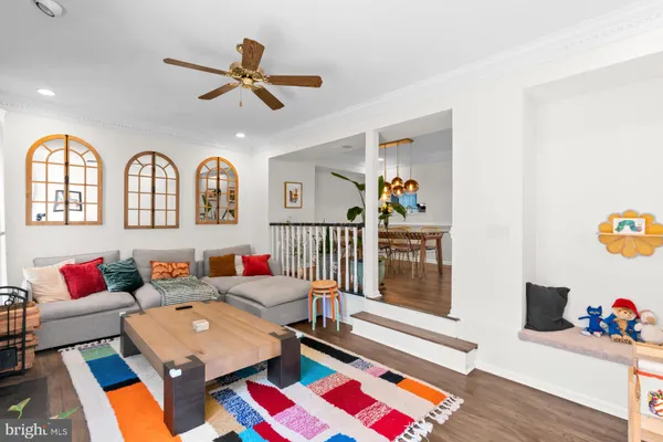a living room with furniture and a rug