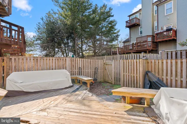 a white bench sitting in front of a building