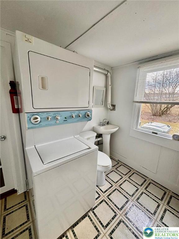 6024 Front Street Bangor, PA 18013 - Photo 11 of 12 a bathroom with a sink a toilet and a window
