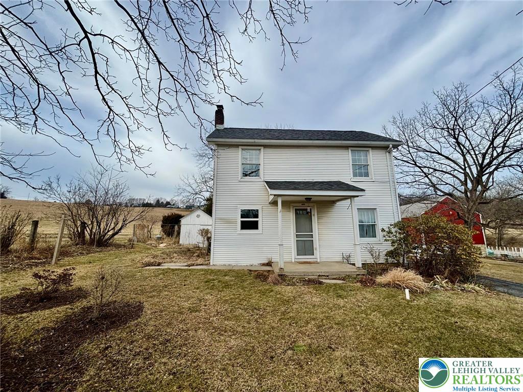 6024 Front Street Bangor, PA 18013 - Photo 2 of 12 a view of a house with a yard