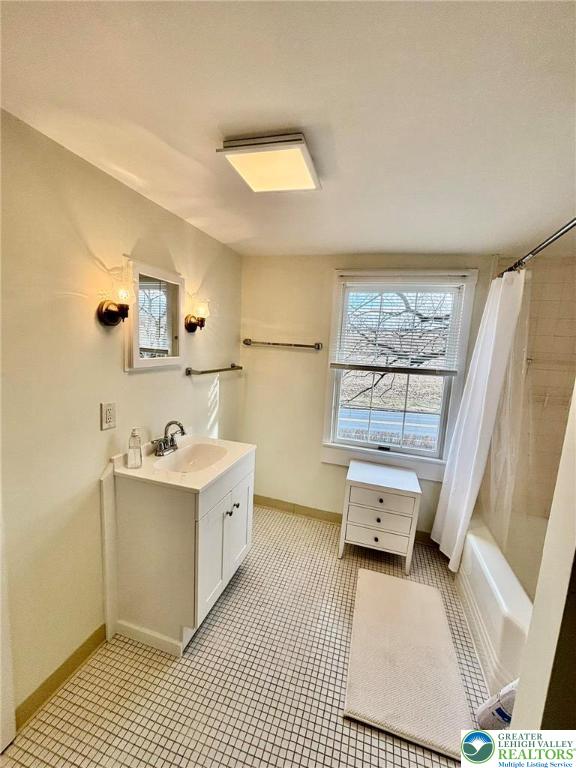 6024 Front Street Bangor, PA 18013 - Photo 6 of 12 a kitchen with a sink a window and white cabinets