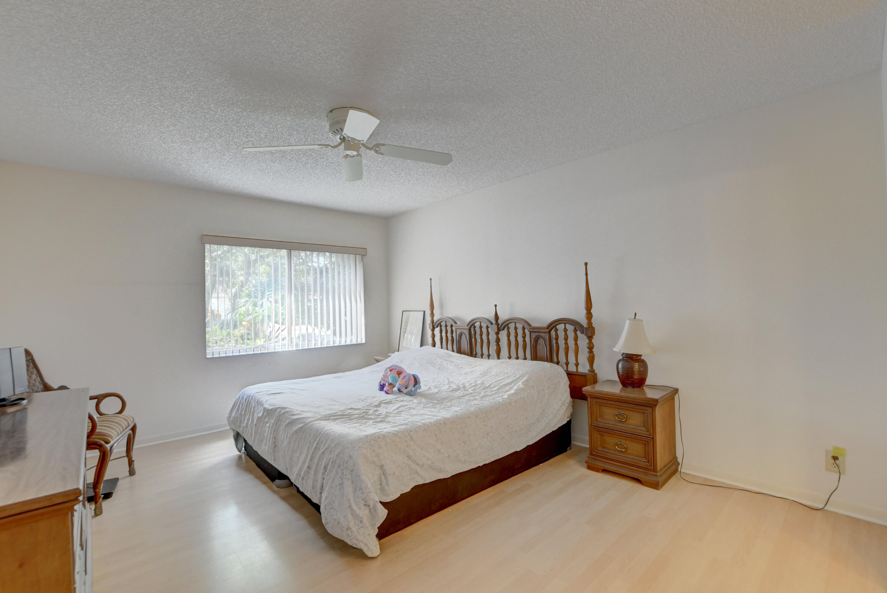 8089 Springtree Road Boca Raton, FL 33496 - Photo 19 of 44 a bedroom with a bed and window