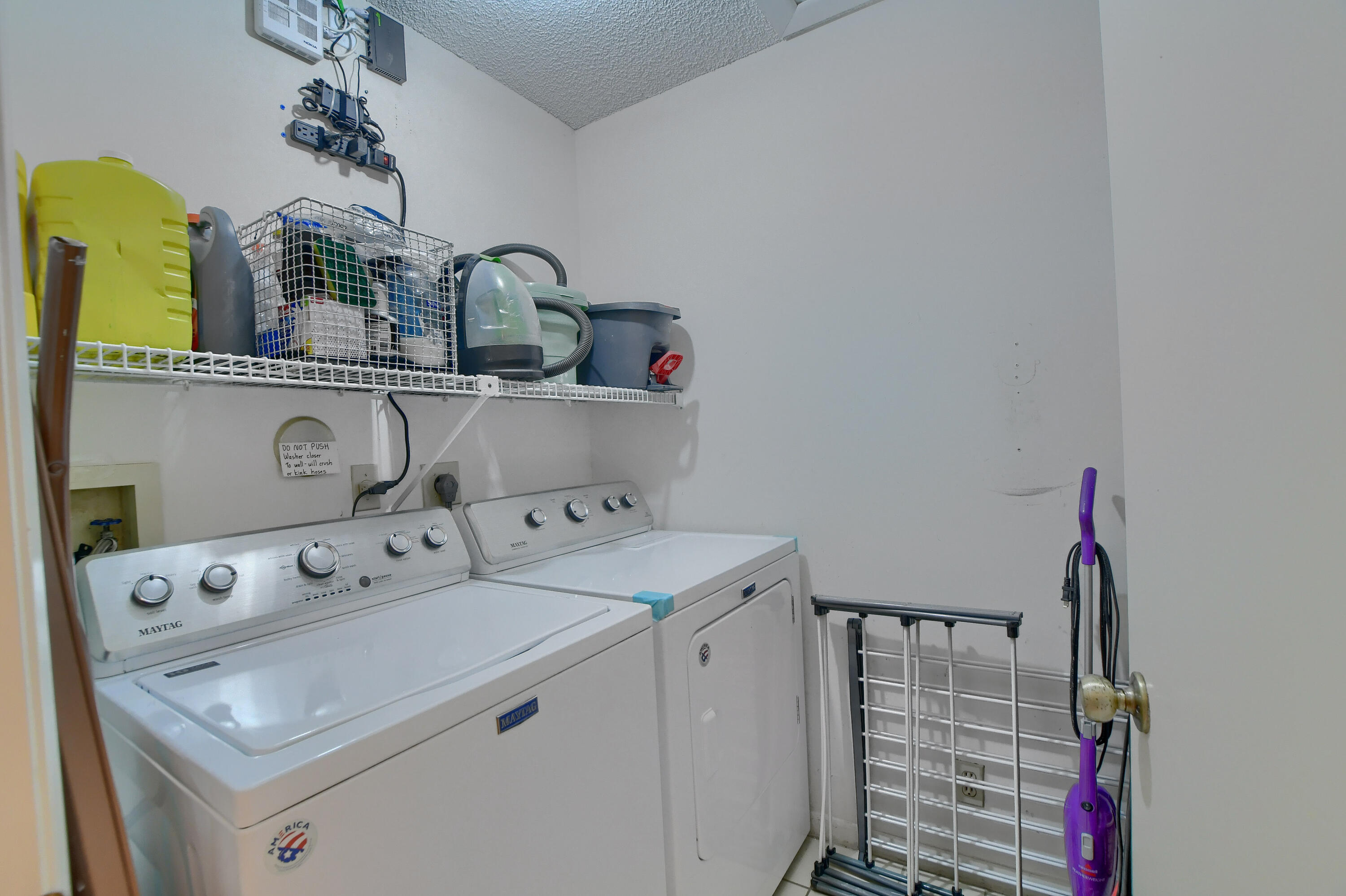 8089 Springtree Road Boca Raton, FL 33496 - Photo 27 of 44 a utility room with dryer and washer