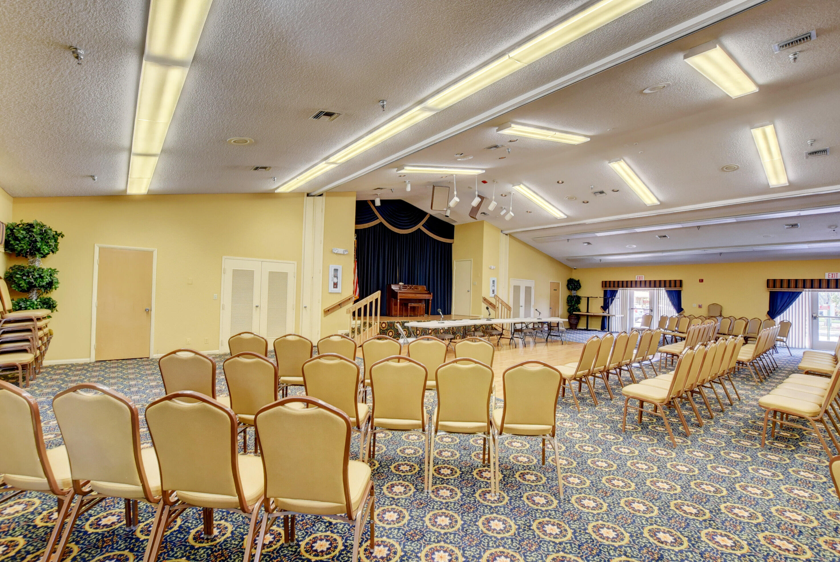 8089 Springtree Road Boca Raton, FL 33496 - Photo 33 of 44 a living room with lots of chairs and a table