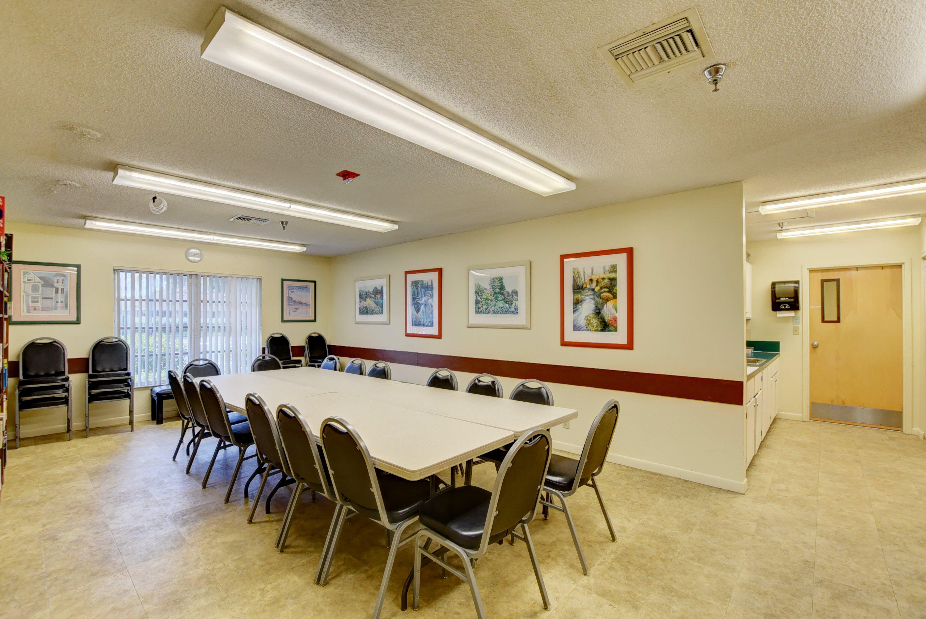 8089 Springtree Road Boca Raton, FL 33496 - Photo 34 of 44 a view of a dining room with furniture and chandelier